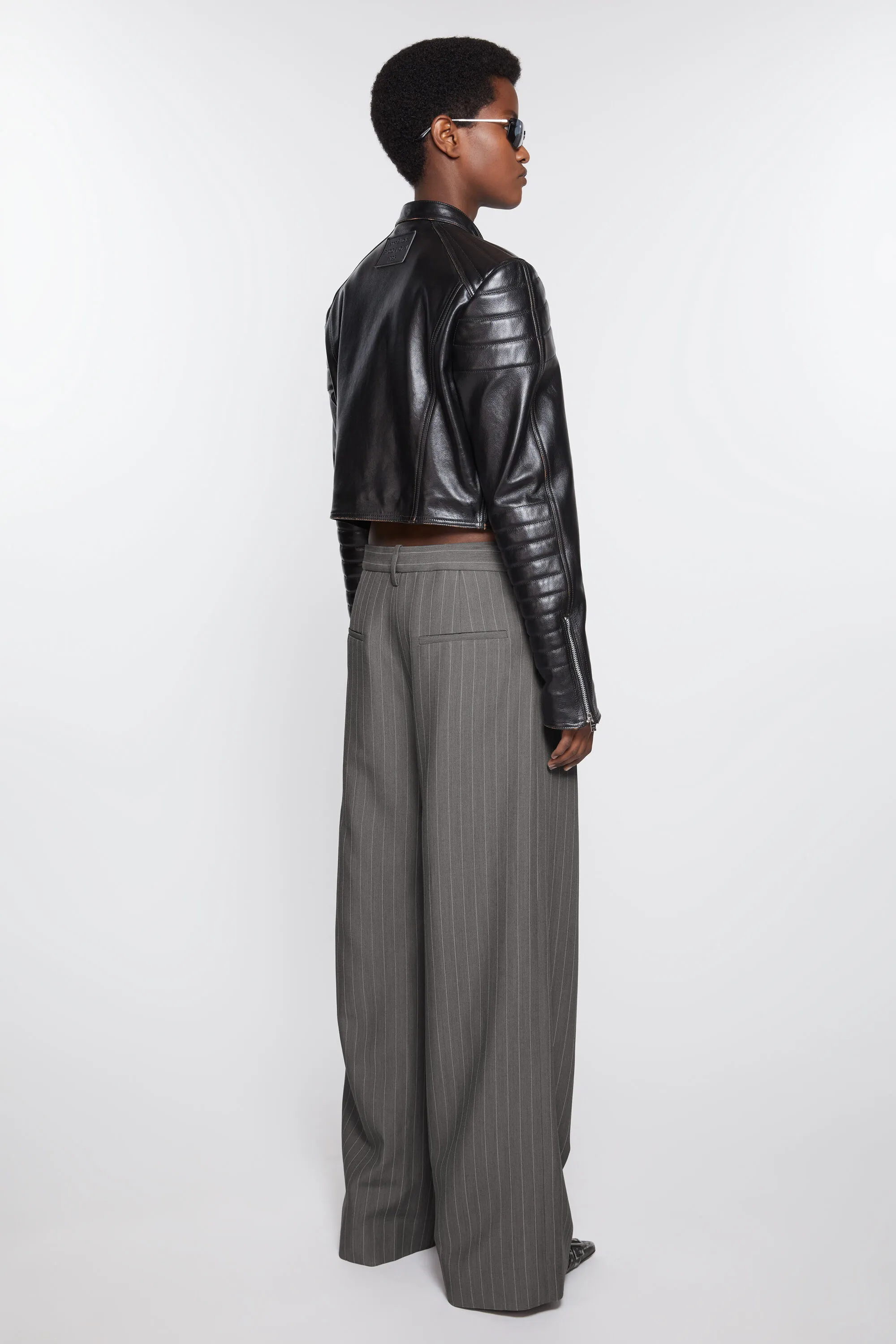 Deconstructed pinstripe trousers