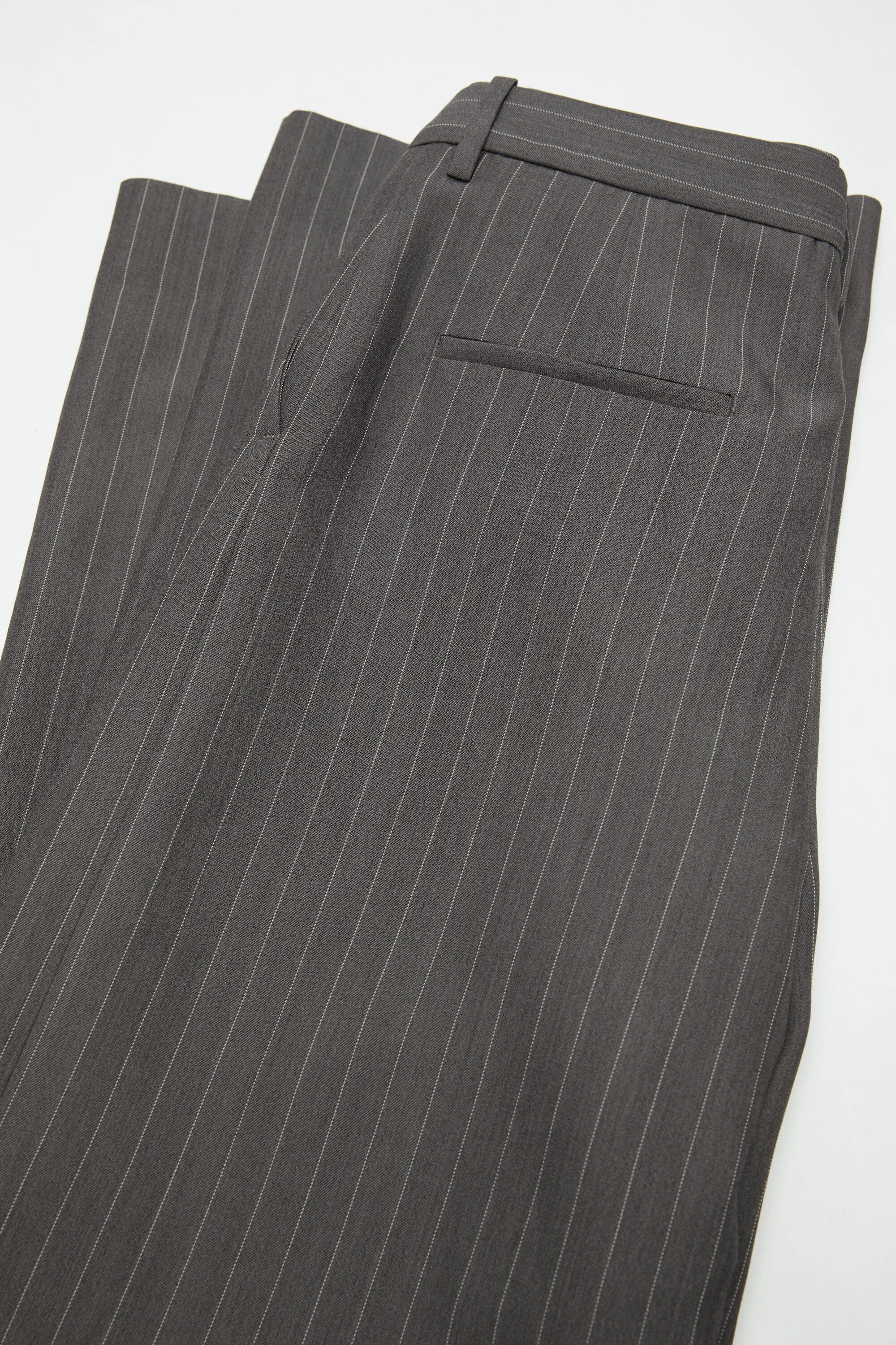 Deconstructed pinstripe trousers