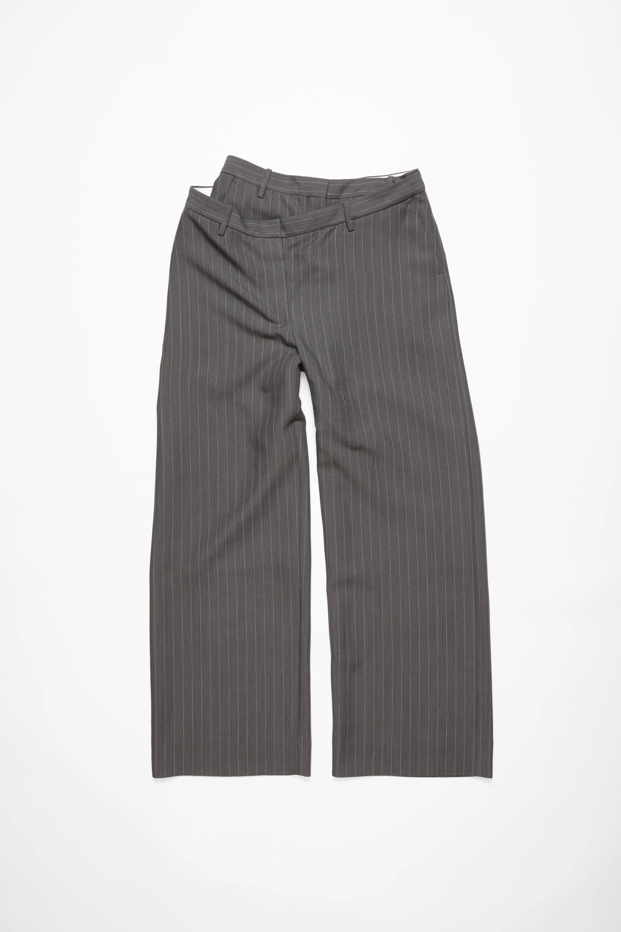 Deconstructed pinstripe trousers